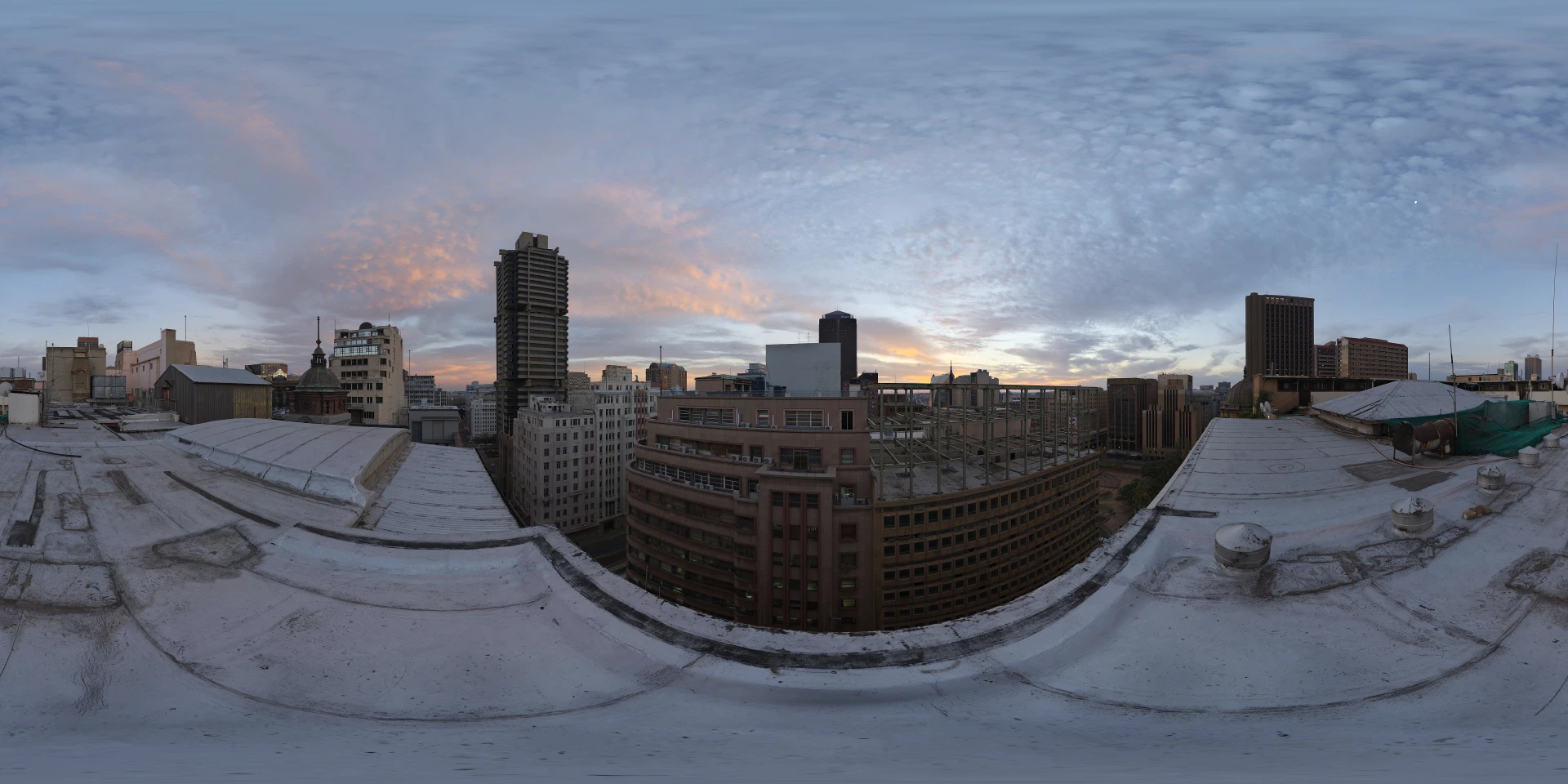 A real city at dusk, where bodies, energy, infrastructure and computation meet