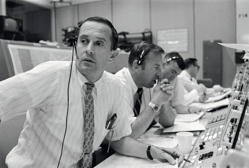 Flight controllers at consoles in Mission Control during Apollo 11's lunar descent.